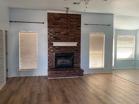 Fireplace and built in bookcase. Living floors installed Dec 2022