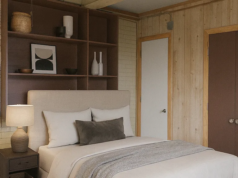 Front bedroom with plenty of room for bed and study desk. Built in shelves for extra storage. Furniture is staged