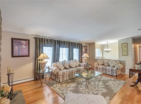 Hardwood flooring throughout the main level.  Spacious living room.