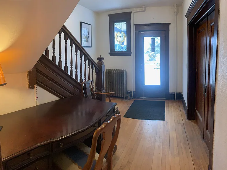 Front entrance - 4th bedroom to the right with double doors closed, executive desk under staircase