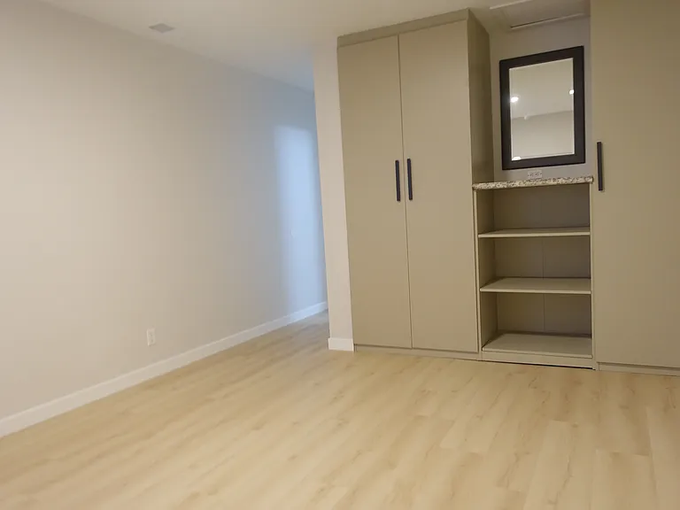 Bedroom #1: Generous room with ensuite bathroom. Built-in closet system with multiple curtain rods and shelves.