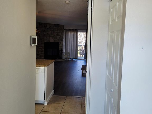 Entry Hallway with storage closet to the right and entrance to the kitchen on the left.