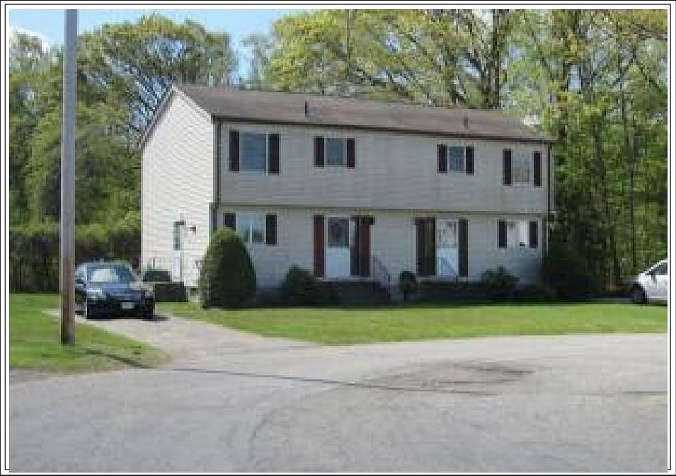 front of townhome with private driveway and off-street parking