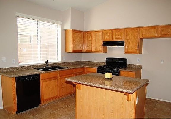 Upgrades include solid surface countertops, tile, new carpet and neutral paint