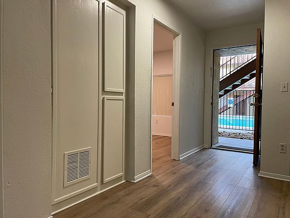 Facing pool and front door.