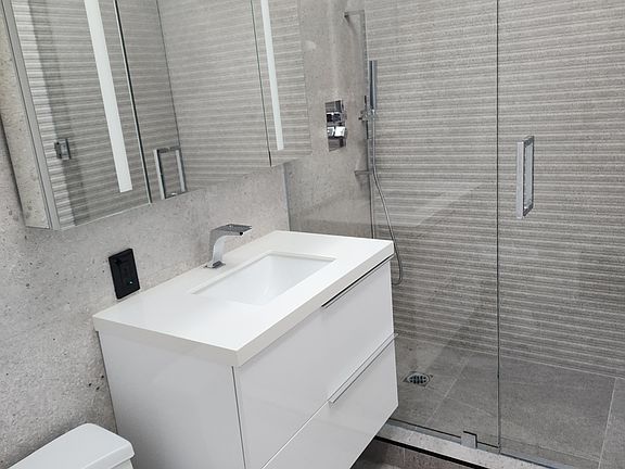 2nd bath..custom shower with vanity and sky light