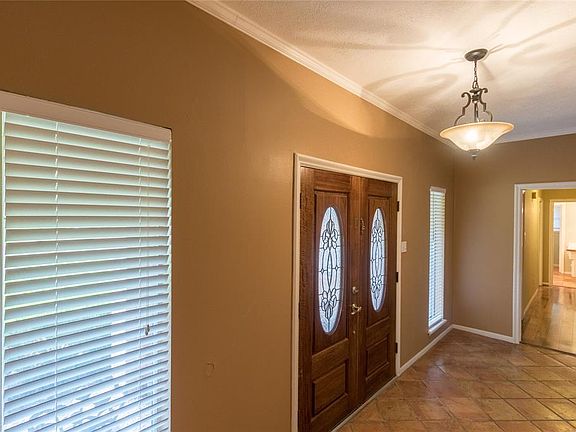 Beautiful double doors greet you as you enter
