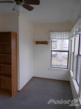 Enclosed front porch provides additional living space.