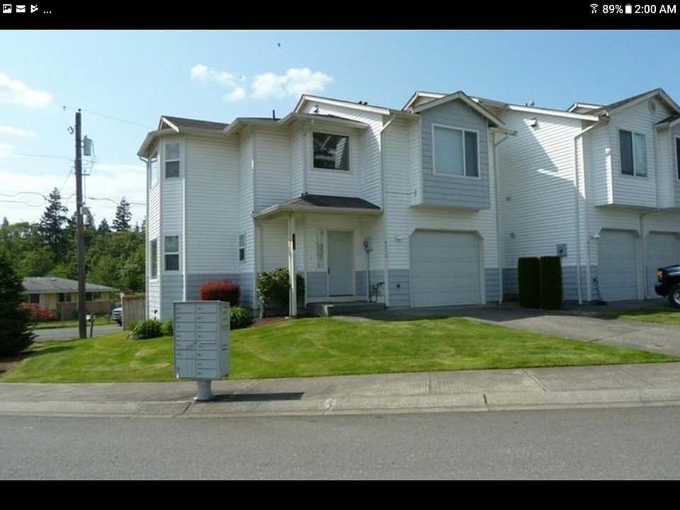 Front of Townhouse. Over garage is the master bedroom, next is sun window by office area that you can see Mt. Rainier from.