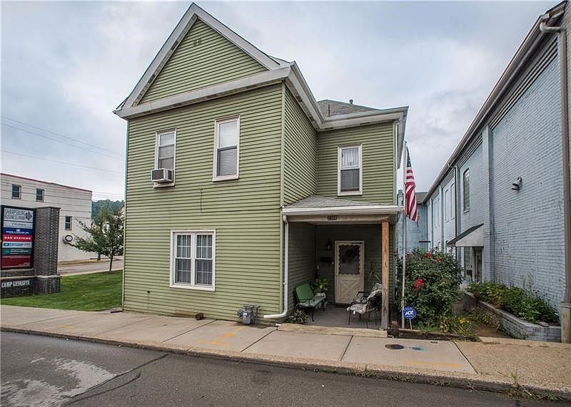 Three bedroom home with adorable front & back porches conveniently located right off the Highland Park Bridge. The exit is set t