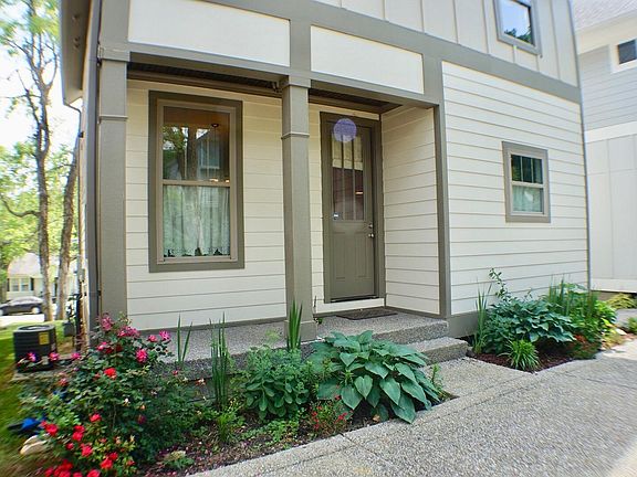 Rear of home with parking for 2