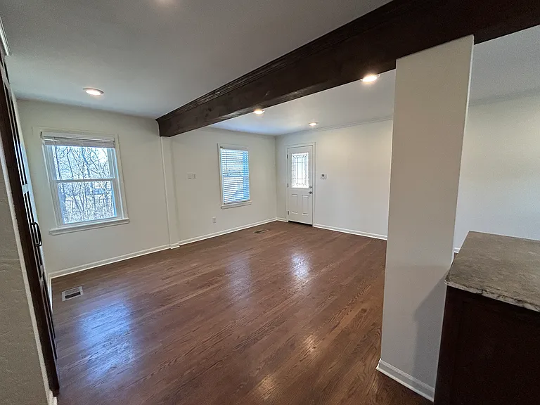 Living room opens to deck and the backyard.