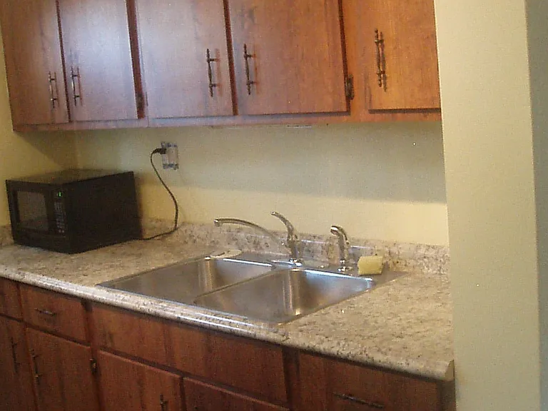 New countertop with stainless steel sink and countertop microwave