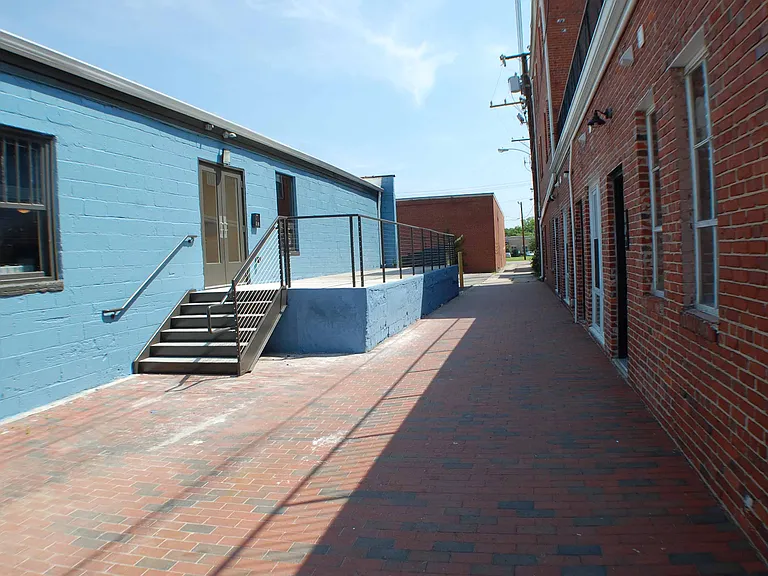 Back Patio area perfect for studying and soaking in some rays butts up against our sister property, Butterworth Lofts!