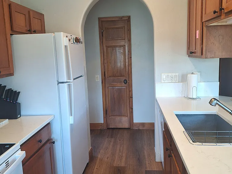 Full kitchen with range, refrigerator with ice maker, dishwasher and over the stove microwave.