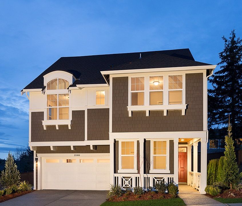 The BAINBRIDGE features 5 bedrooms, 3.75 baths; 2-story foyer; spacious great room opens to the gourmet kitchen w/center island & dining room; desirable main floor bedroom & ¾ bath; large 2nd floor loft ideal for kids' hideaway; oversized daylight basement features private guest suite plus ample space for endless possibilities.  Photo not of actual home - may contain optional features.  