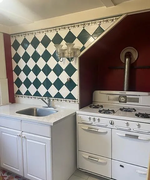 Italian tiled kitchen with gas stove