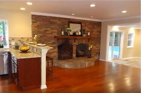upper living room/florida room. fireplace is painted white now