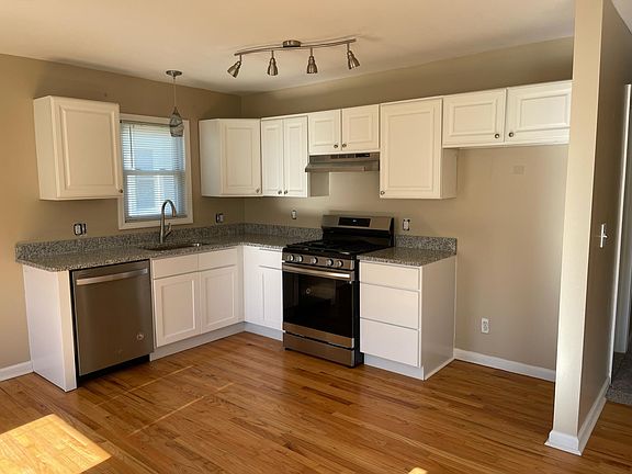 Newly renovated kitchen with beautiful granite counters and all stainless steel appliances. (new fridge being delivered next week)