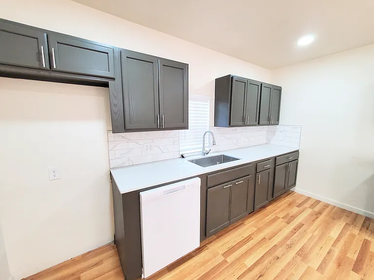Sink area and dishwasher. Refrigerator is not provided but can be requested for $25 per month