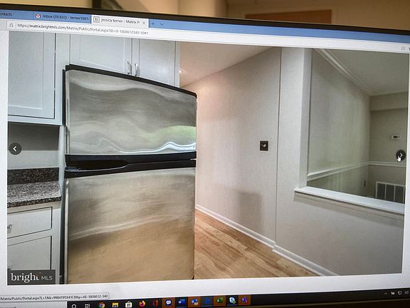 Interior -- View of Beginning of Hallway from kitchen to bedrooms and bathrooms. Can see a touch of the livingroom from this image.
