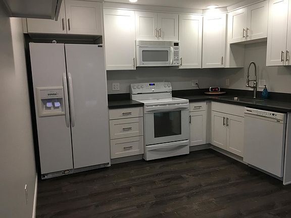 Sparkling new quartz counter-top and soft-close drawers/cabinets. Generous kitchen sink with industrial-style faucet. Newer appliances. Large capacity, counter-depth refrigerator. Oven includes efficient convection baking options.