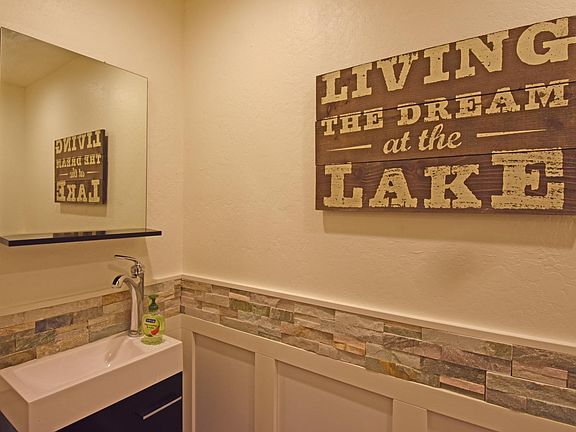 powder room 1/2 bath with sink and toilet