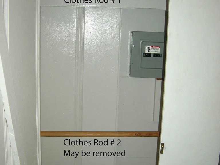 Back Room closet with 2 clothes rods, Upper storage shelf.