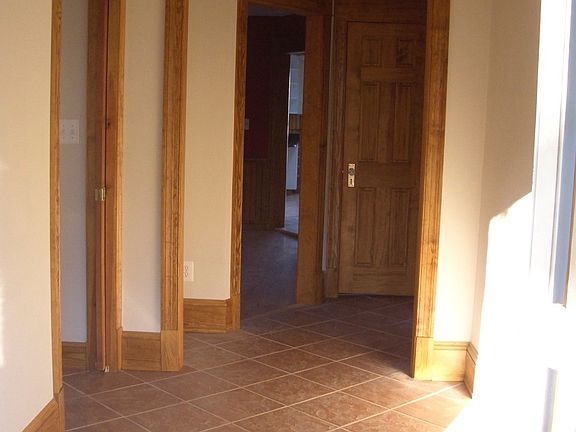 Entering the foyer from the front door, hall bath with laund