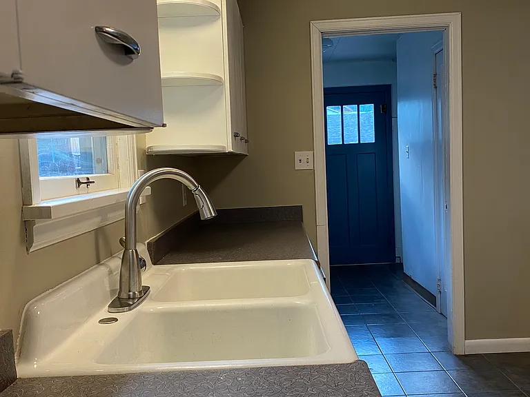 Kitchen looking into laundry room