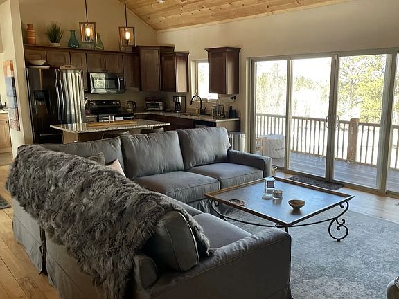 open living room & dining area with gorgeous views & lots of light