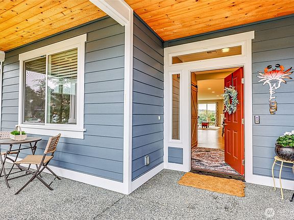 Charming, covered entry thatâ€™s perfect for enjoying your morning coffee or afternoon tea. A welcoming front door features stylish side lights for a delightful touch.>