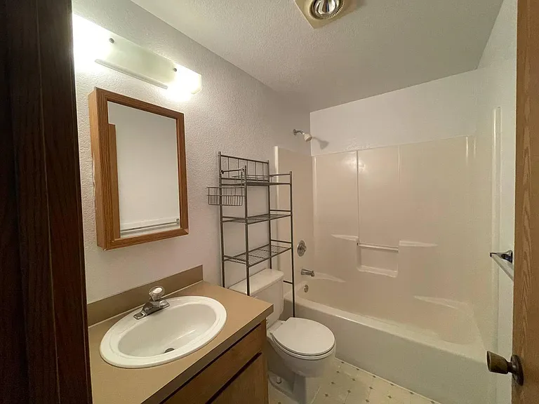 Full bathroom with tub/shower combination. Bathroom has been updated since these photos were taken.