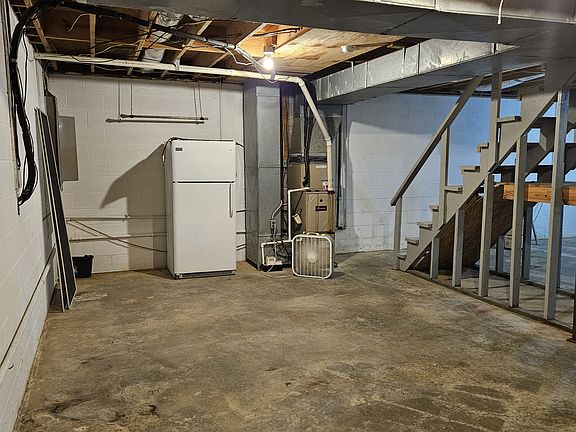 Basement with older fridge that works