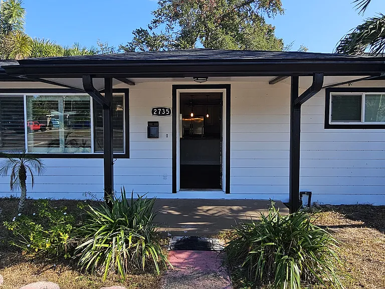 Come on in! Check out the brand new siding, paint and front porch!
Beautiful paved walkways and pavers to access front and back yard