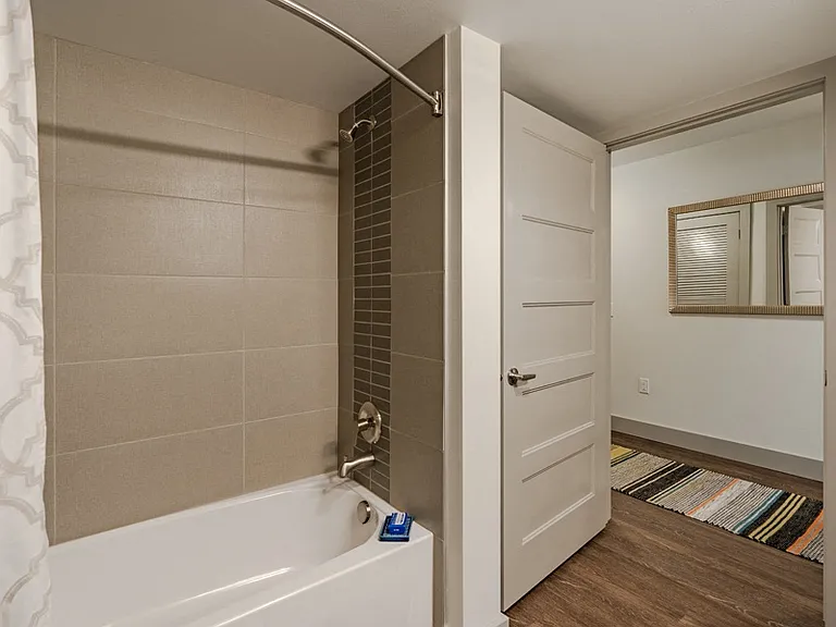 Bathrooms with soaking tubs and curved shower rods