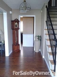 Bright entry way : All new flooring in entryway, kitchen and livingroom.