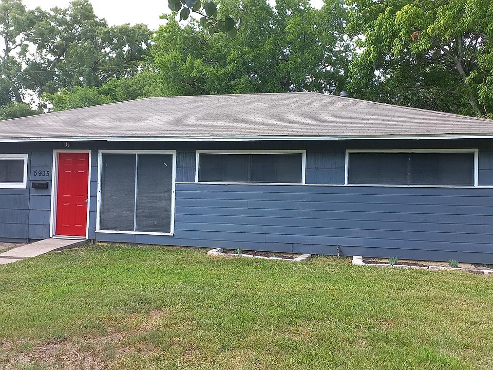 Inviting curb appeal with eye catching Red front door