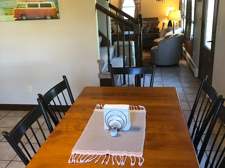 Dining table and view of living room