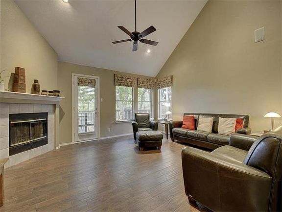 This home features High Vaulted ceilings in this relaxing Family room.