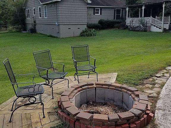 Firepit in backyard by pool