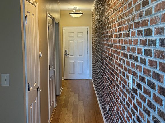 Hallway view from living room to exit