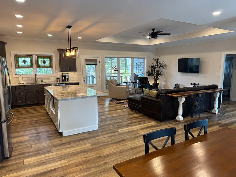 Open concept kitchen-living-dining with lake view