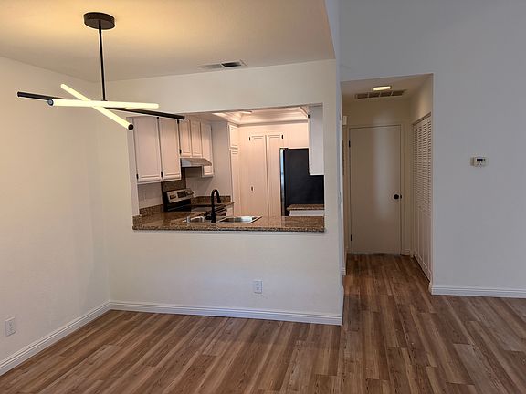 Dining room with view into kitchen