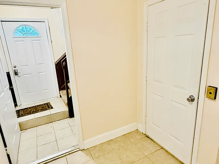 First floor elevator access and side door access (side door to left side of building). Also access to garages