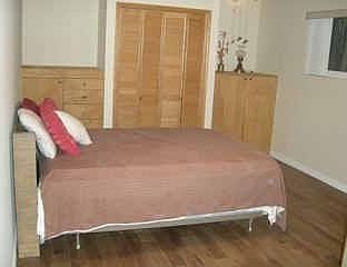 Master Bedroom with new Hardwood Flooring and Built-Ins 