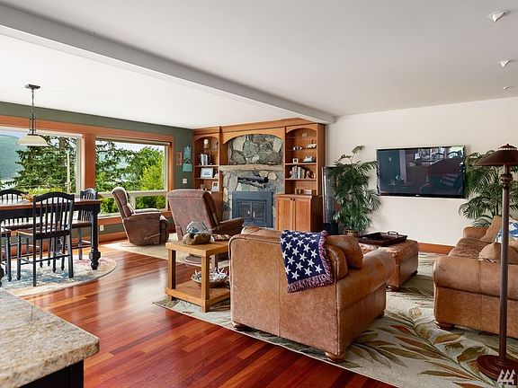 Living room, seating area, and second dining space with a breathtaking view of the water.