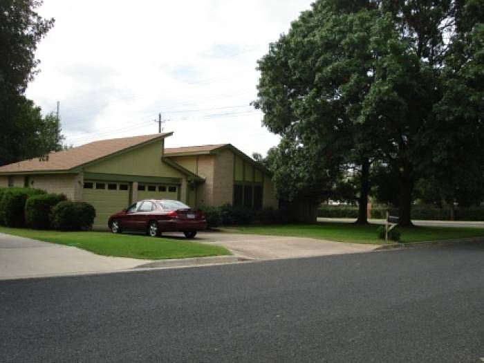 Front of home, huge trees