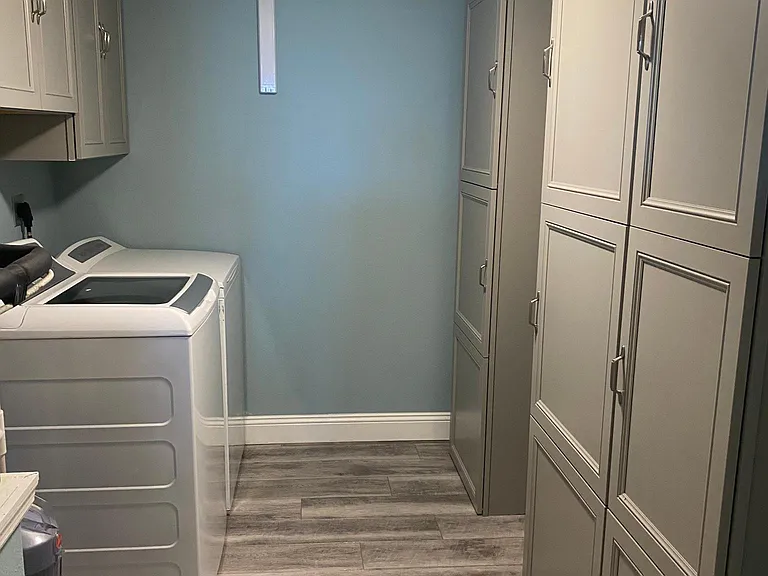 Walk in laundry room with lots of storage