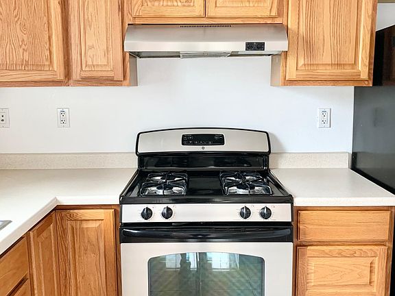 Unit #1 kitchen has plenty of cabinets and stainless steel appliances